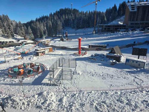 a resort in the snow with a ski lift at Lu and Ma in Jahorina