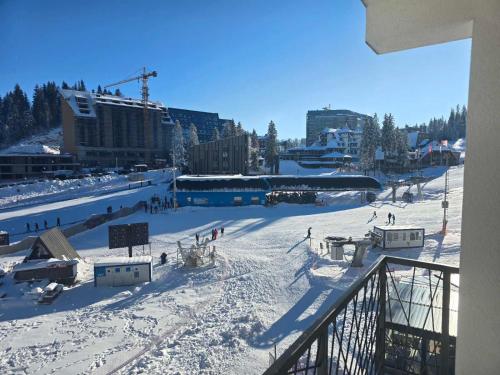 a group of people on a ski slope in the snow at Lu and Ma in Jahorina