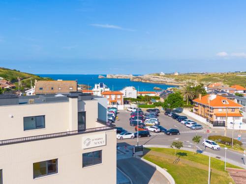 an aerial view of a town with a parking lot at La marina sunset 3000 in Soto de la Marina