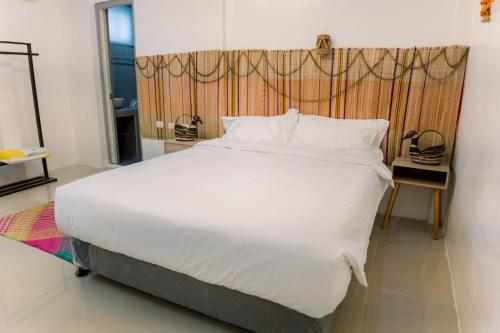 Postel nebo postele na pokoji v ubytování 8 Plus Beach Resort