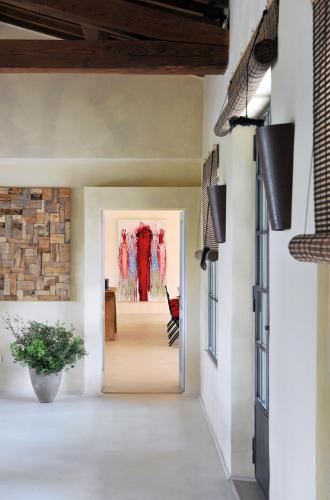 a hallway of a home with a brick wall at New Stylish Villa with Swimming Pool in Capalbio in Pescia Fiorentina