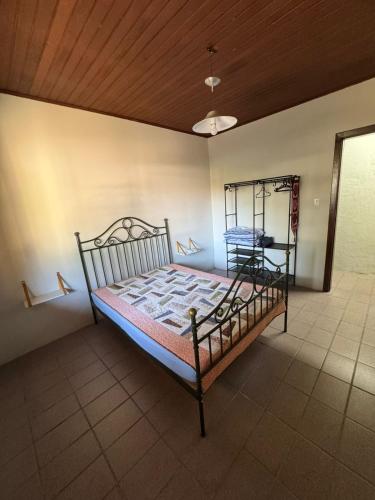 Postel nebo postele na pokoji v ubytování Curta o paraíso Enseada de Brito