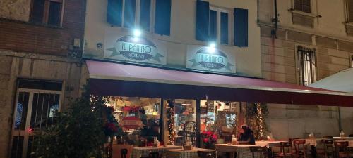 a restaurant with tables in front of a building at A due passi da Piazza Cavalli in Piacenza