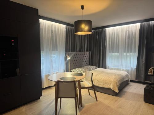 Ένα ή περισσότερα κρεβάτια σε δωμάτιο στο Apartamenty Walczaka