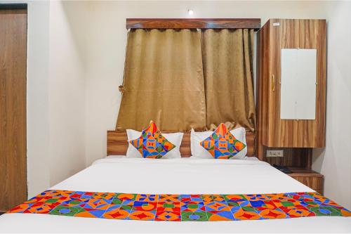 Katil atau katil-katil dalam bilik di Fabhotel The Mantra inn - Nr world trade center