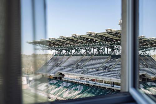 a view of an empty stadium from a window at ETO Park Hotel Business & Stadium in Győr