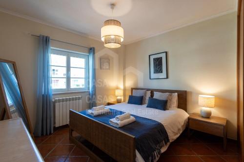 En eller flere senge i et værelse på Kiko's House by ACasaDasCasas