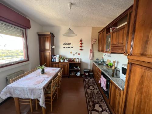 a kitchen with a table with chairs and a tableablish at Ciao Brescia in Brescia