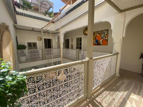 a balcony of a house with a fence at Riad Bacha Beldi in Marrakech