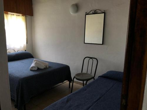 Een bed of bedden in een kamer bij Hostería Michel