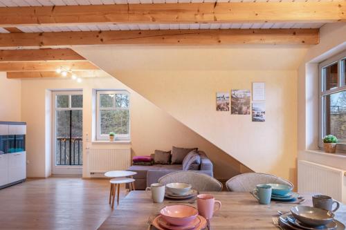 a living room with a table and a couch at Ferienwohnung 2 Hof Schäfer in Waldeck