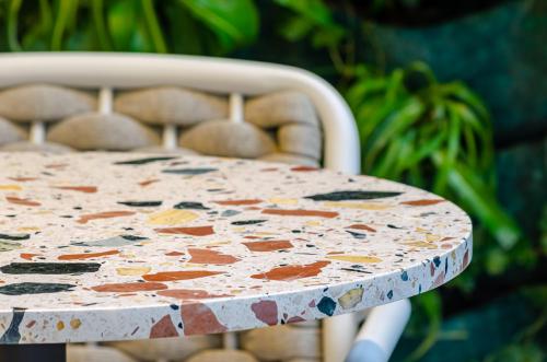a table with a painted table top on a chair at TURIM Lisboa Hotel in Lisbon