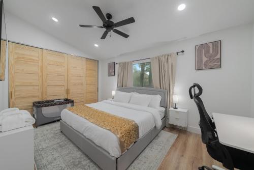 a bedroom with a bed and a ceiling fan at Luxury in Euless Near DFW Airport & Cowboys stadium in Euless