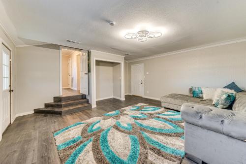 a living room with a couch and a rug at Updated Home 2 Mi to Downtown Texarkana! in Texarkana