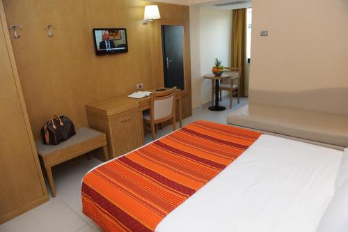 Letto o letti in una camera di Hotel Ristorante La Campagnola