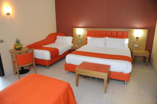 Letto o letti in una camera di Hotel Ristorante La Campagnola
