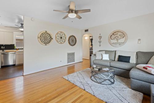 a living room with a couch and a ceiling fan at Doras Dream, 4 Bedrooms, Sleeps 12, Downtown in Mount Dora