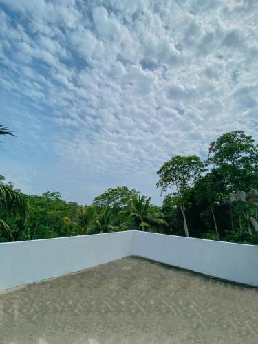 a view from the roof of a house with trees at Stille Oase Inn in Matara
