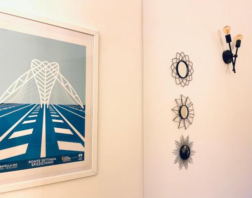 a framed picture of a ferris wheel on a wall at Biffi 2 - Garbatella Rooms in Rome