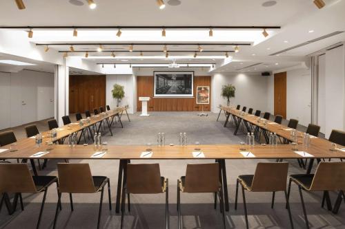 a large conference room with a large table and chairs at Radisson Collection Astorija Hotel, Vilnius in Vilnius