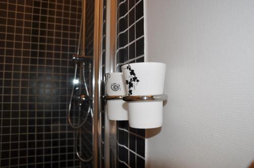 a couple of toilet paper dispensers in a bathroom at Spånhults Herrgård Hotel in Norrahammar