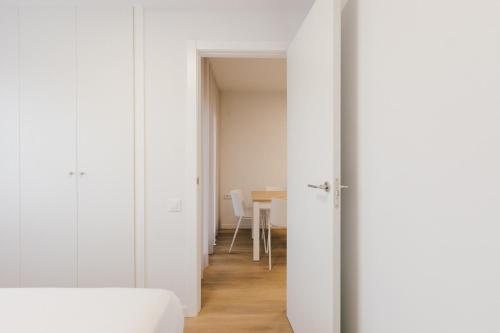an open door to a dining room with a table at Pio XII Apartments Valencia in Valencia