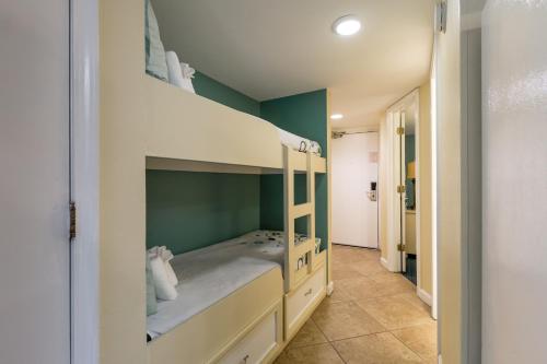 a bunk bed in a room with a green wall at Peppertree By The Sea in Myrtle Beach
