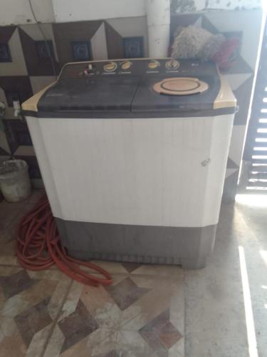 a stove sitting on the floor in a room at AK family Home Stay in Gaushala