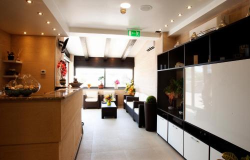 a lobby of a building with couches at 'A Nuciara Park Hotel & Spa in Furci Siculo