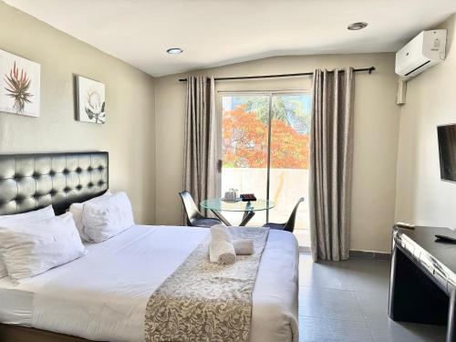 Postel nebo postele na pokoji v ubytování Angel Boutique Hotel