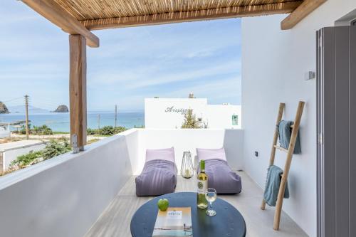 a dining room with a view of the ocean at Nove Milos Luxury by Estia in Pollonia