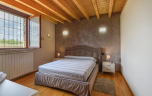 En eller flere senge i et værelse på Golfando & Bacco