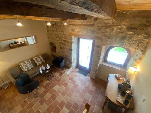 an overhead view of a living room in a building at Les Caselles, Gîte et Chambre d'hôtes in Saint-Beauzély