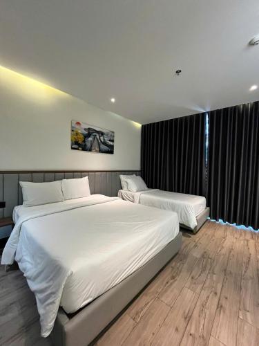 Ένα ή περισσότερα κρεβάτια σε δωμάτιο στο Apec Mandala Hotel-Spa Whyndham Tuy Hòa