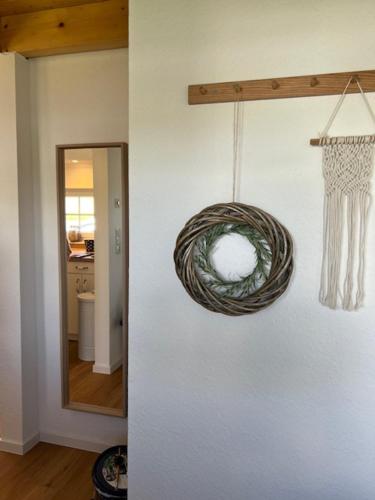 a room with a rope hanging on a wall at Gemütliches Reetdachhaus in Oesterdeichstrich