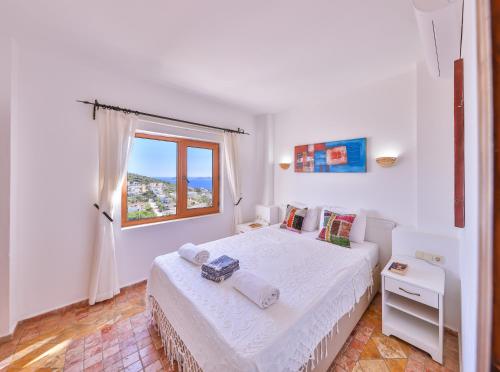 Giường trong phòng chung tại Lebi Derya