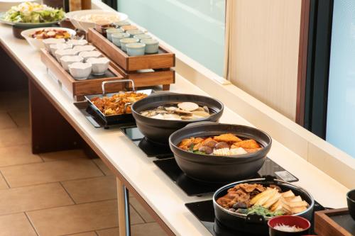 a buffet line with many different types of food at Hotel Global View Tsu in Tsu