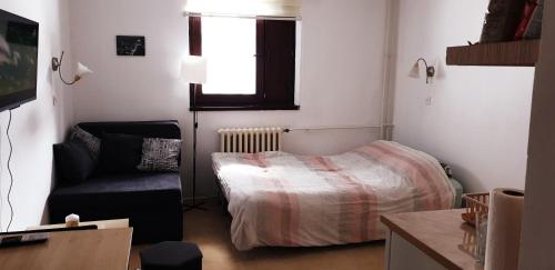 Una cama o camas en una habitación de Vila Yeti Kopaonik