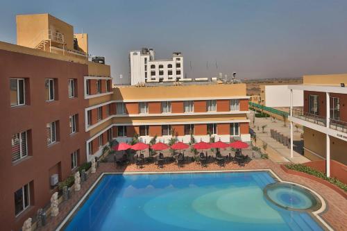 an aerial view of a hotel with a swimming pool at Club Mahindra Dwarka in Dwarka