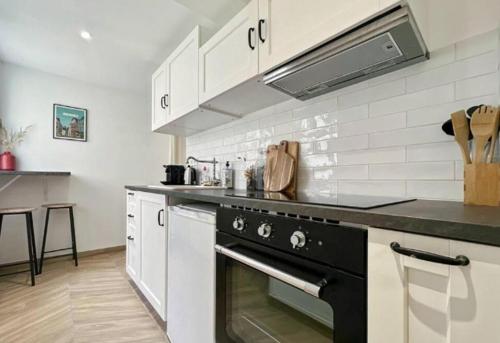 Kuchyň nebo kuchyňský kout v ubytování Appartement Cosy Rennes Centre Historique - 4 personnes