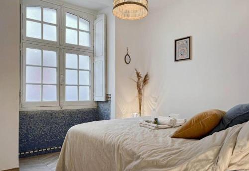 Postel nebo postele na pokoji v ubytování Appartement Cosy Rennes Centre Historique - 4 personnes