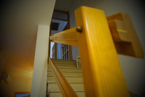 a view of a wooden stairway with a door at Il Sentiero in Verona