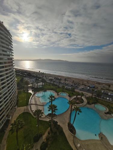 a view of the beach from the balcony of a resort at Departamento Vista al Mar, condominio Jardín del Mar in Coquimbo