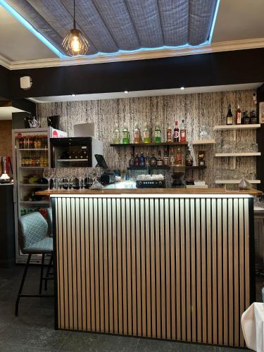 a bar in a restaurant with a counter with a bar sidx sidx at Hotel Taormina Brussels Airport in Zaventem