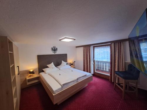 Postel nebo postele na pokoji v ubytování Haus Tirol Appartements