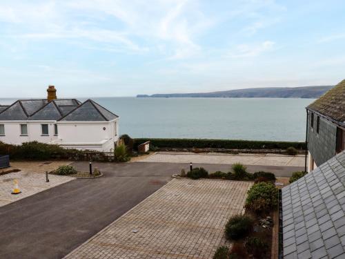 a house with a view of a body of water at Blue Horizon in Port Isaac