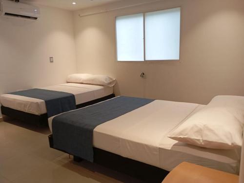 Postel nebo postele na pokoji v ubytování Hotel Med 33