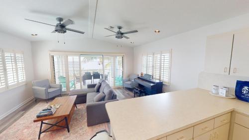 a living room with a couch and a table at Sea La Vie in Cudjoe Key