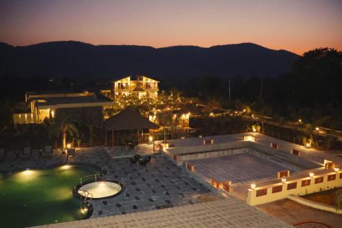 a view of a swimming pool at night at The Grand Sariska Baagh in Tehla