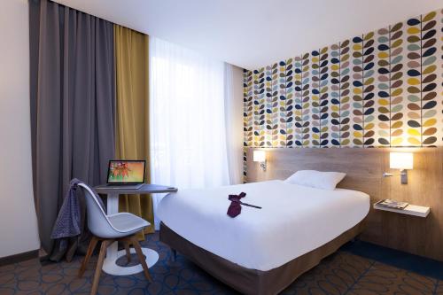 Katil atau katil-katil dalam bilik di ibis Styles Chaumont Centre Gare